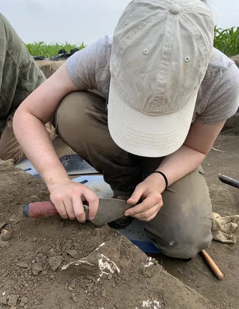 Anthropology student Hannah Maines excavating at Coan Hall