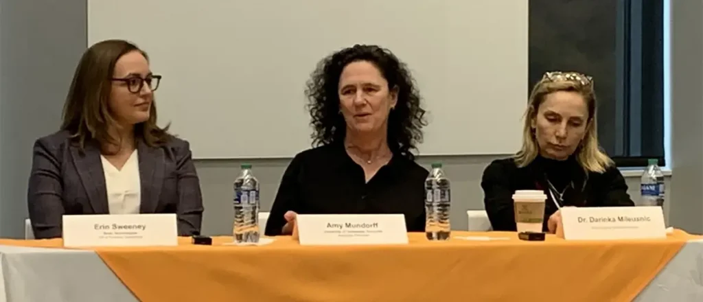 Three women speaking during a panel discussion